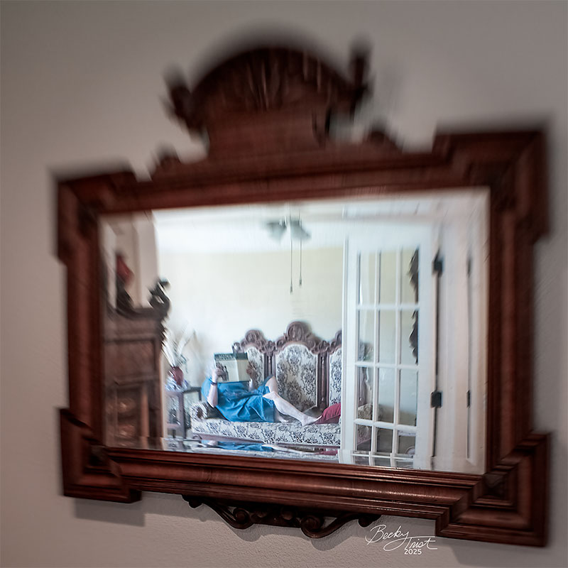 Women Reflected in Mirror Reading A Book | Lensbaby Composer Pro Sweet 35