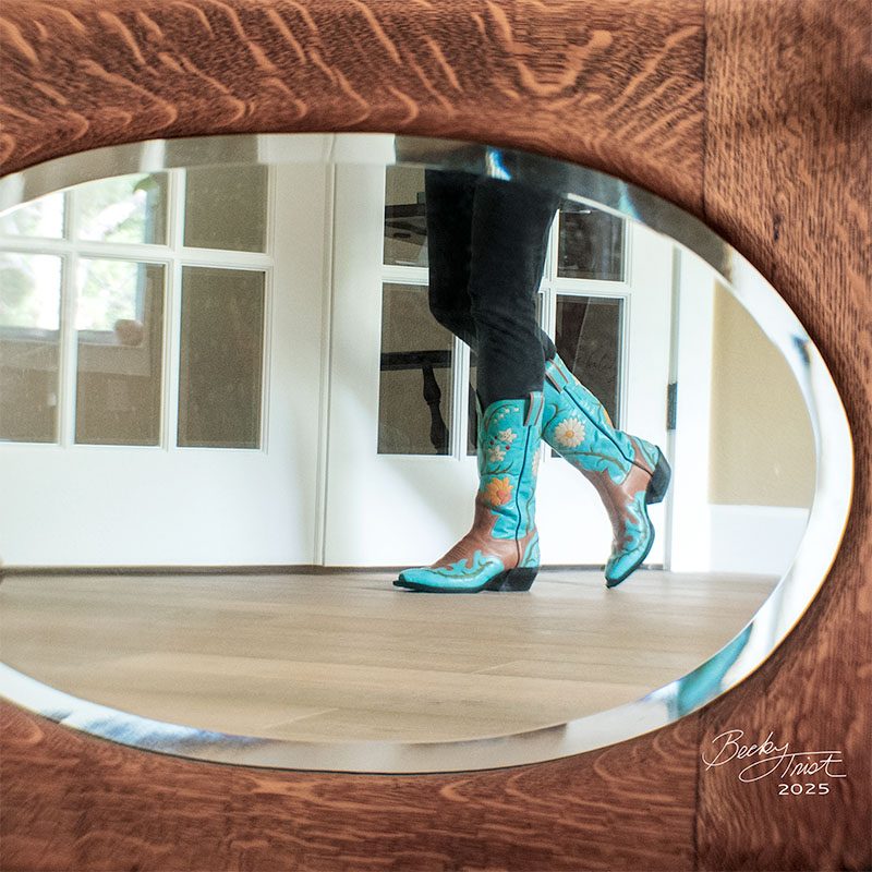 Woman wearing custom boots reflected in mirror | Lensbaby Composer Pro Sweet 35